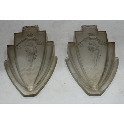 211 - A pair of Art Deco frosted glass fan shaped wall sconces, moulded with dancing female figures in a s... 