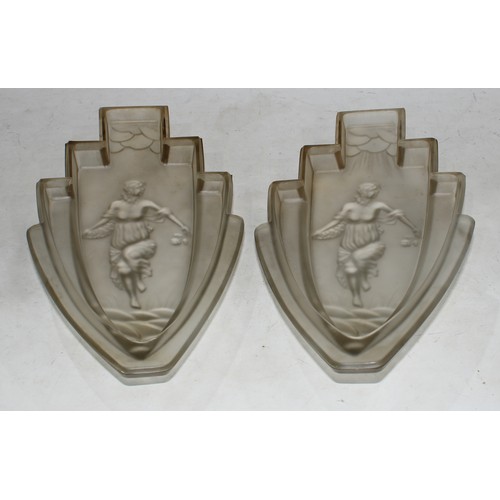 211 - A pair of Art Deco frosted glass fan shaped wall sconces, moulded with dancing female figures in a s... 