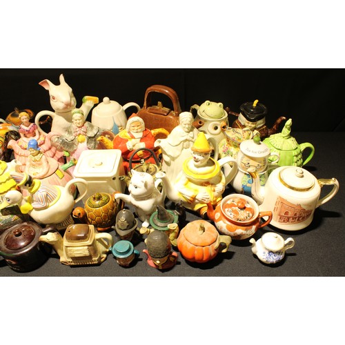 267 - A collection of novelty teapots, including a Price Kensington toby style teapot; Santa Clause teapot... 