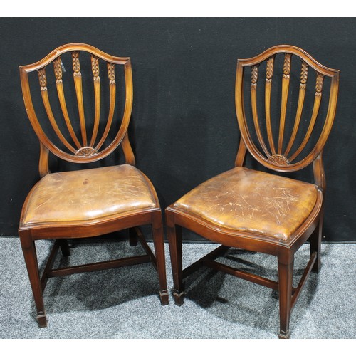 227 - A set of six Hepplewhite style mahogany dining chairs, shield shaped back with carved splats, drop-i... 