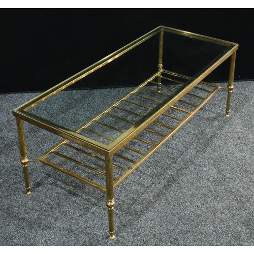 230 - A 20th century brass coffee table, rectangular glass top, fluted legs, 41cm high, 111cm wide.