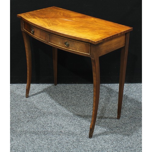 298 - A George III style bow front mahogany side table, oversailing top above two short cockbeaded drawers... 