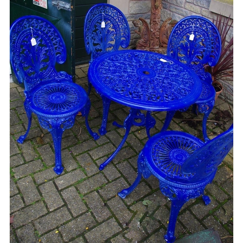 528 - A cast metal patio set comprising circular table and four chairs (5)