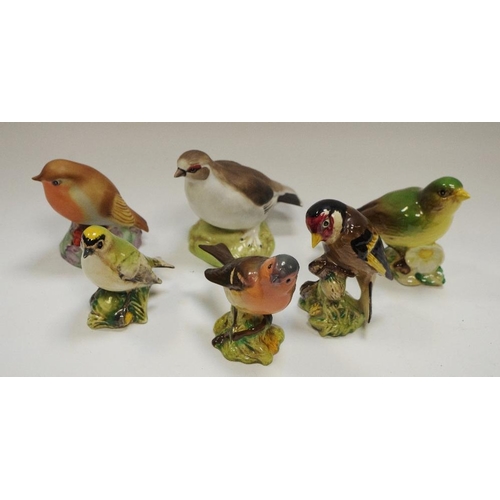 64 - A Beswick Goldfinch no. 2273, Goldcrest no. 2415, another no. 166; a Royal Worcester Robin no. 3197;... 