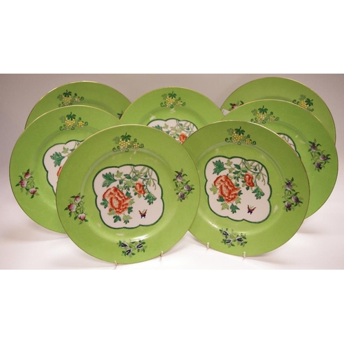 75 - A set of seven Hong Kong Famille Verte plates, decorated with a peony within a raised green cartouch... 