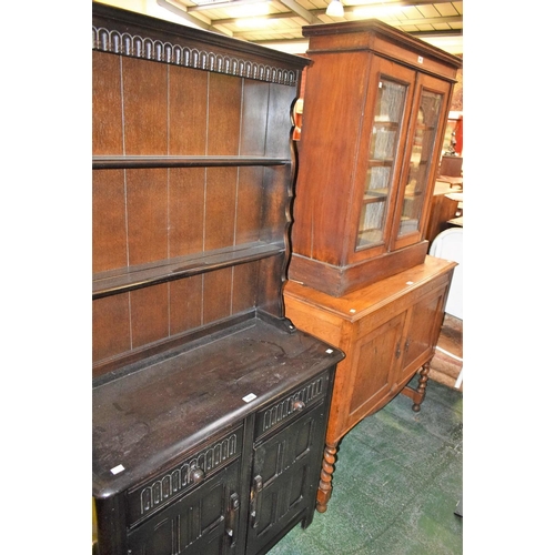 559 - An early 20th century mahogany glazed bookcase; a light oak sideboard; a Priory style dresser, of sm... 