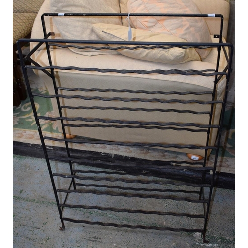 563 - Salvage & Reclamation - a wrought metal wall mountable wine bottle rack, 94cm high