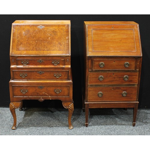 296 - A 20th century walnut and mahogany bureau, fall front enclosing pigeonholes and small drawers above ... 