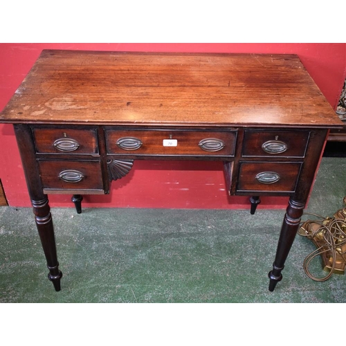 70 - A George III Revival mahogany writing desk, rectangular top above an arrangement of drawers, tapered... 