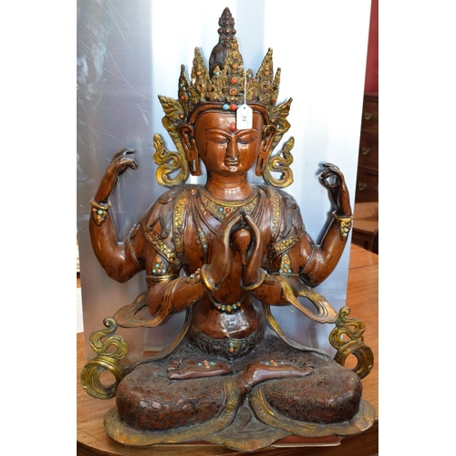 71 - A large cast metal sculpture of Vishnu, 76cm high