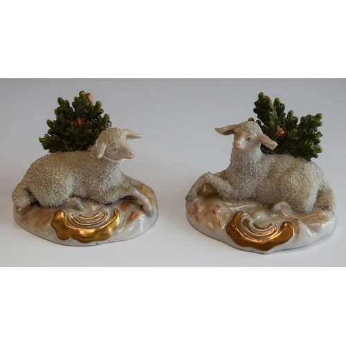 84 - A pair of late 19th century Continental models, of sheep, cartouche-shaped bases, c.1900