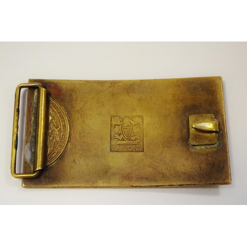 317 - A Pirelli belt buckle designed by Salvador Dali (1904-1989), the front embossed in relief with an er... 