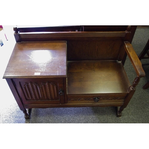 421 - A walnut veneered floor standing corner cupboard; an oak telephone seat. (2)