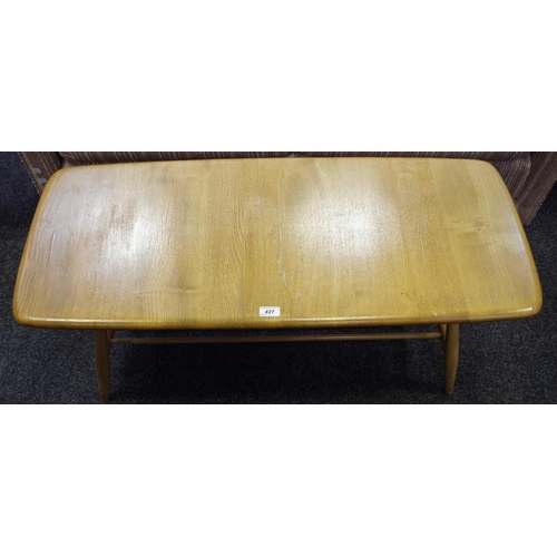 427 - An Ercol elm coffee table with spindled undertier.