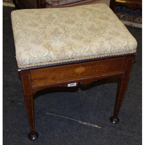 429 - An Edwardian inlaid mahogany piano stool;