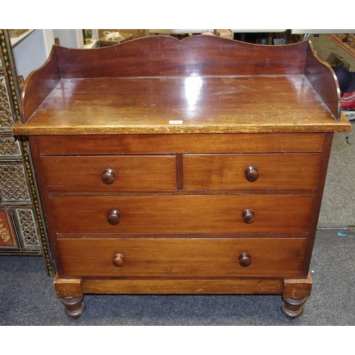 430 - A Victorian mahogany wash chest shaped three quarter gallery two short drawers over two long turned ... 