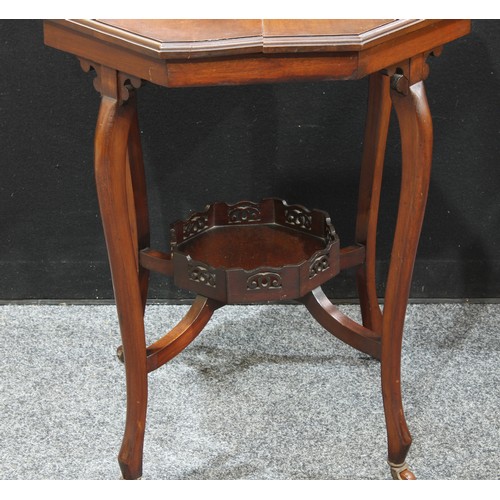 293 - An Edwardian mahogany octagonal occasional table, pierced under tier, four legs with casters, 73cm h... 