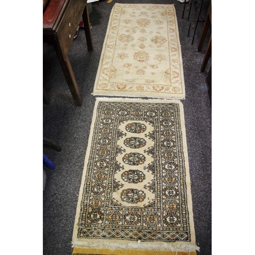 303 - A pair of Ziegler design Pakistan wool throw rugs on fawn ground, 140cm x 73cm; a runner, geometric ... 