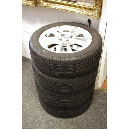 304 - Four Vauxhall Astra wheel rims. two fitted with Continental tyres and two with Falcon tyres (4)