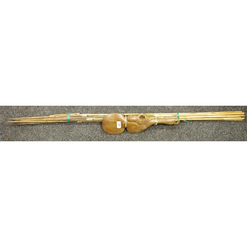 327 - Tribal Art - a Maori patu hand club, inlaid with abalone shell; various spears