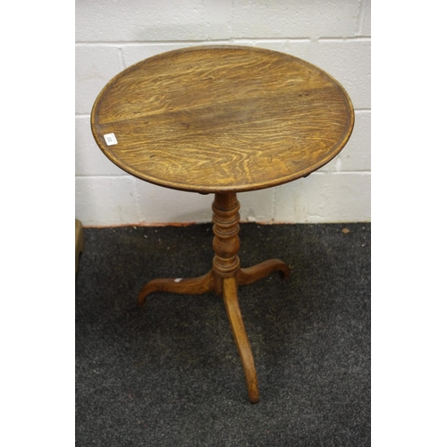 332 - A George III oak tilt top occasional table, dished circular top, turned column, cabriole legs. 74cm ... 