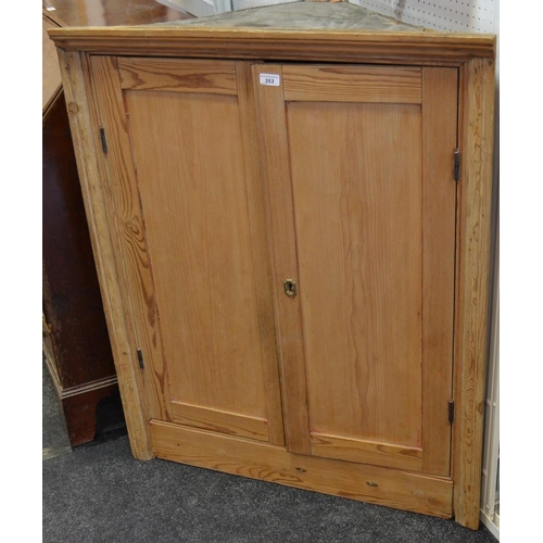 353 - A 19th century pine corner cupboard