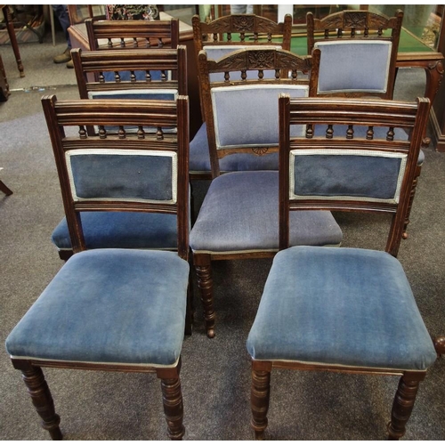 354 - A harlequin set of seven oak dining chairs.