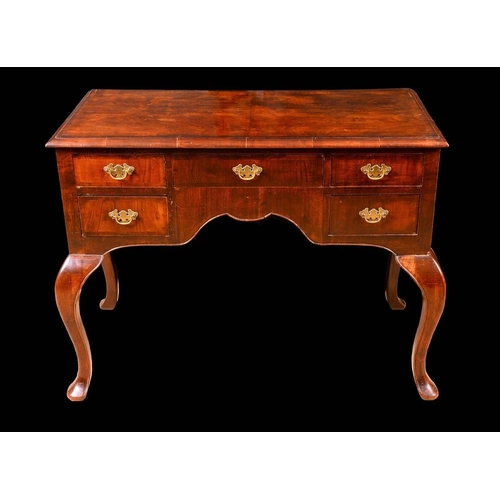 1696 - A George I Revival crossbanded walnut lowboy, quarter veneered top above five frieze drawers, square... 