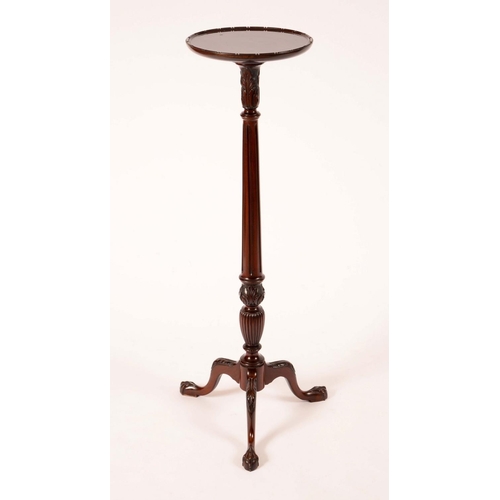 1702 - A Chippendale Revival mahogany statuary torchere, dished circular top above an acanthus capped flute... 