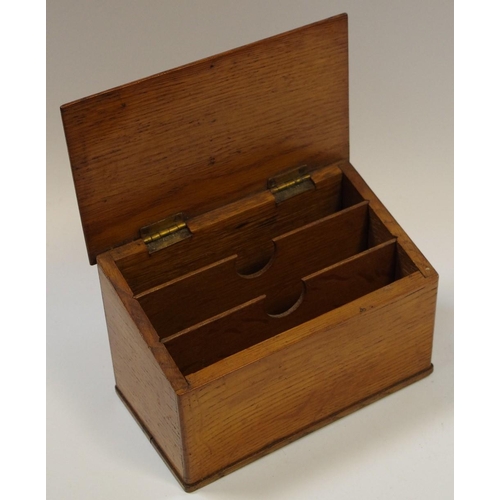 11 - A late Victorian oak slope top stationery box, hinged cover enclosing an arrangement of compartments... 