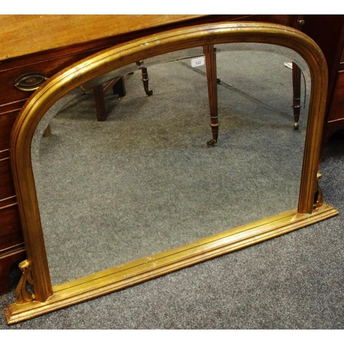 122 - A gilt framed overmantel mirror, arched bevel edge glass 78cm high x 125cm wide