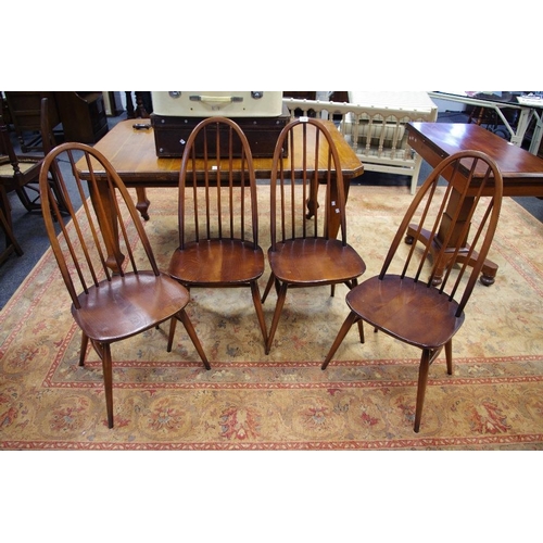 139 - Four Ercol Quaker 365 style dining chairs.