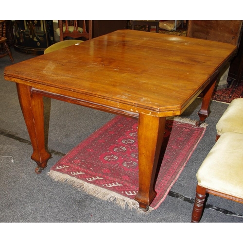 141 - An Arts and Crafts mahogany wind out table, moulded top, canted angles, tapering square legs, cerami... 