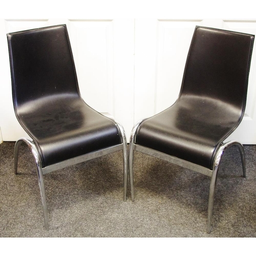 150 - A pair of mid 20th century chrome and leather chairs.