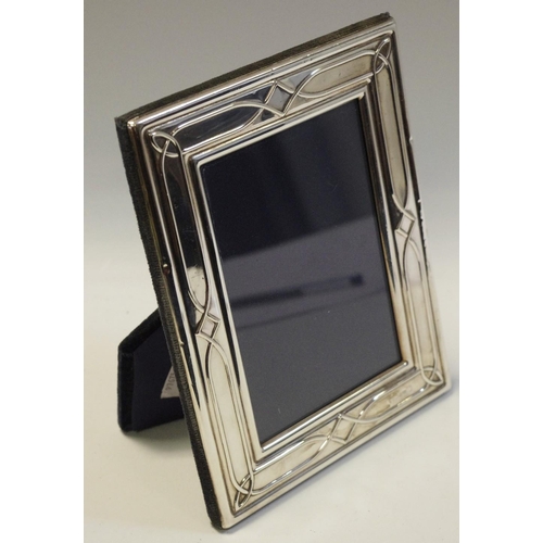 172 - An Arts and Crafts style silver easel photograph frame, Sheffield 1990