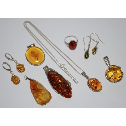 178 - Silver and Baltic amber jewellery various pendants, 2 pairs of drop earrings, a ring and a silver fi... 