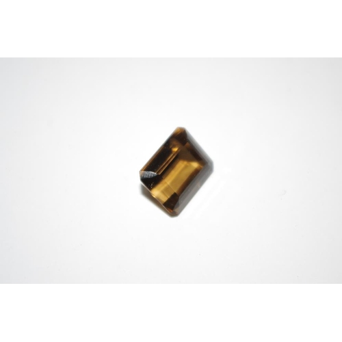 208 - A 23ct emerald cut loose smokey topaz