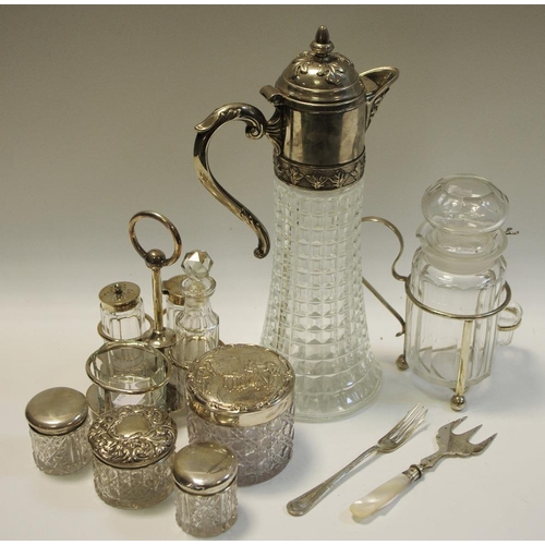 256 - Three silver topped jars; a claret jug with plated mount ; a plated cruet; other plated ware.