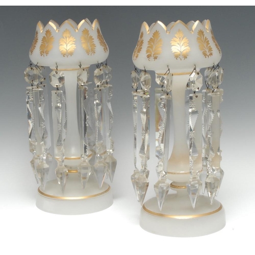 365 - A pair of Victorian opaque glass lustres, castellated rims applied in gilt with stylised leaves, cle... 