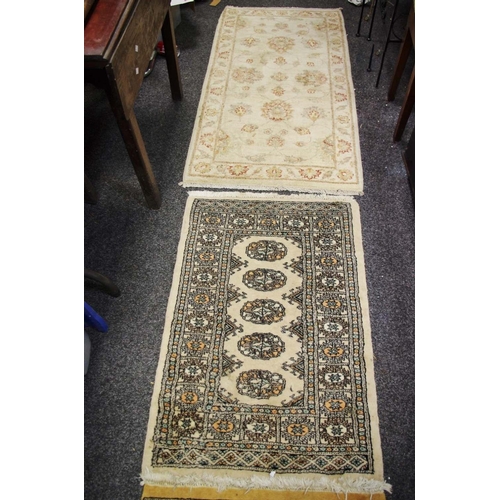 270 - A pair of Ziegler design Pakistan wool throw rugs on fawn ground, 140cm x 73cm; a runner, geometric ... 