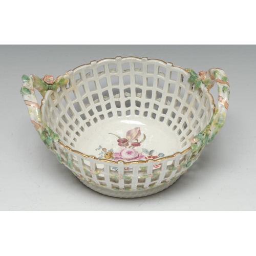 373 - A Berlin two handled basket, painted with flowers, pierced sides, rustic handles, 17.5cm diam, scept... 