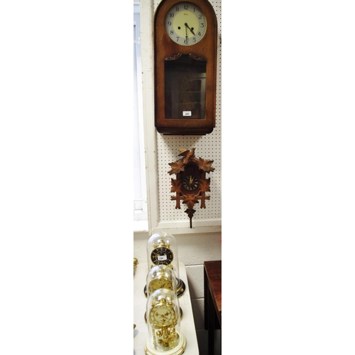 280 - A 1940's Bentima oak cased wallclock; a modern Black Forest style cuckoo clock; a Kundo anniversary ... 