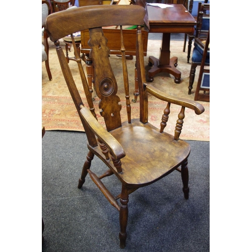 301 - An elm spindle back chair,shaped and pierced splat, saddle seat, turned double H stretchers and legs