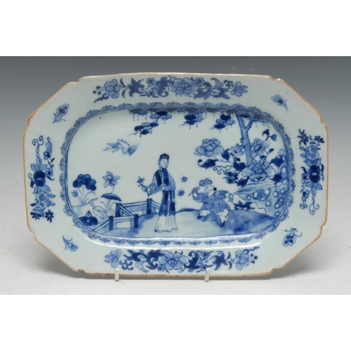 421 - A Chinese canted rectangular meat plate, painted in underglaze blue with a lady and young boy attend... 