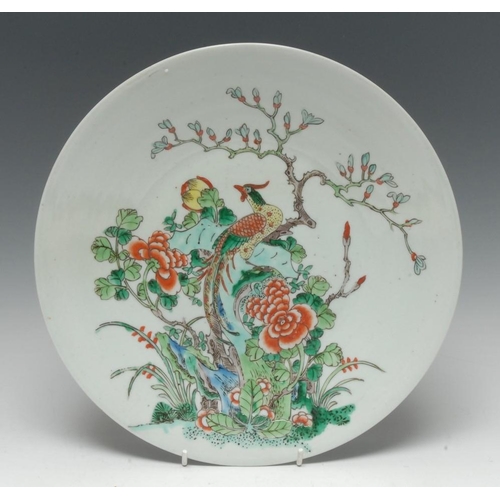 425 - A Chinese circular plate, decorated in polychrome with fanciful bird perched on a blossoming branch ... 