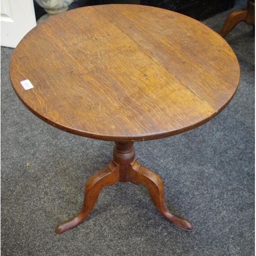 311 - A George III oak tilt top occasional table, circular top, turned column, cabriole legs, pad feet. 66... 