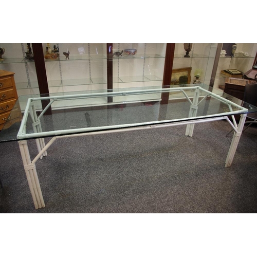 312 - A large glass topped, bamboo conservatory table. 76cm high x 240cm long x 100cm wide.