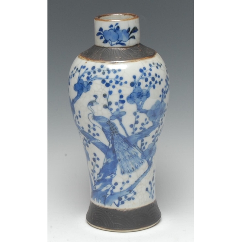 429 - A Chinese Crackle glaze baluster vase, decorated in cobalt blue with blossoming prunus, banded in re... 