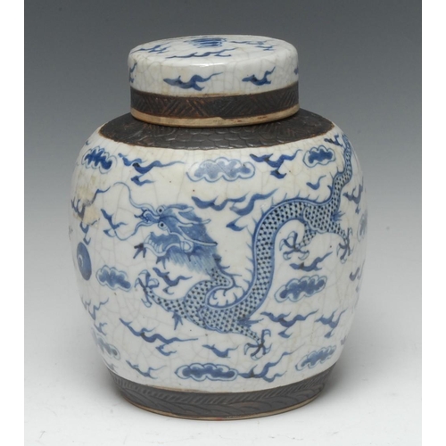 430 - A Chinese crackle glaze ginger jar and cover, decorated in cobalt blue with a scrolling dragons, ban... 