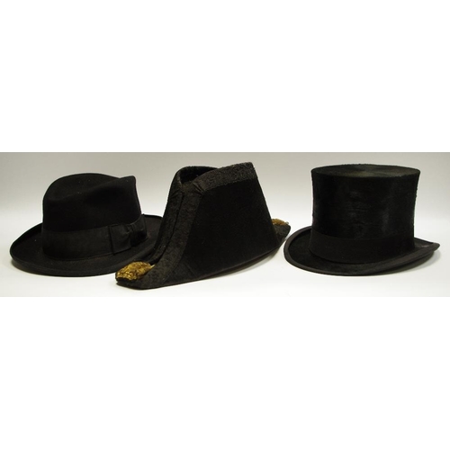 32 - A 19th century bicorn hat; a Christys' silk top hat; a trilby, boxed